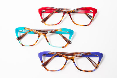 Set of color block cat eye glasses for women. Three colors, top red, middle blue, bottom purple.